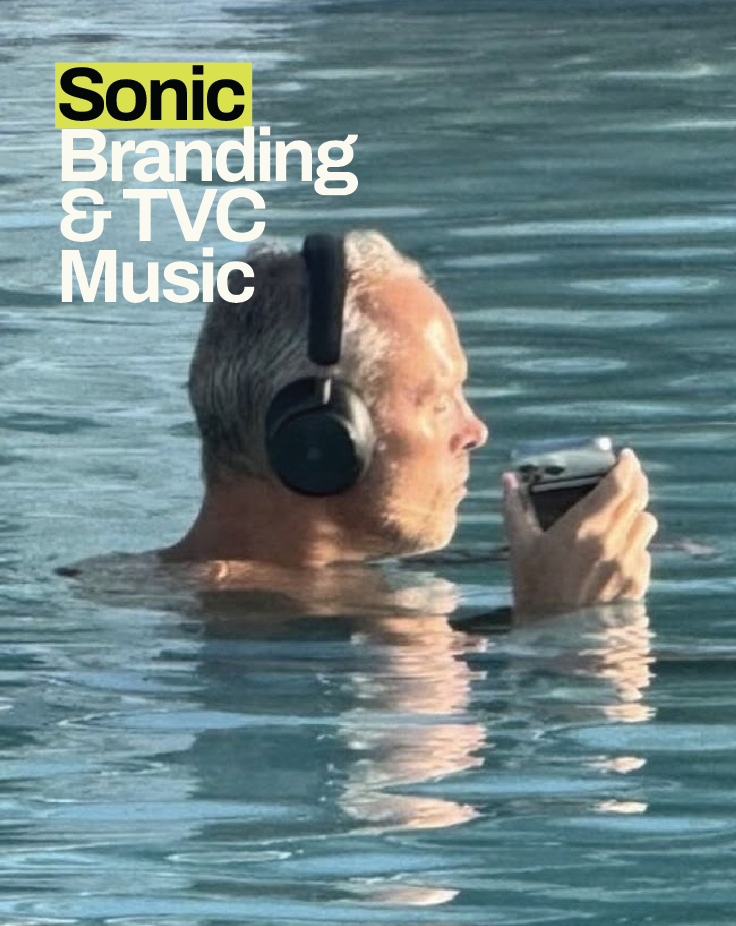 Person wearing headphones in the ocean, representing immersive listening, sonic branding and original music for Australian television commercials.